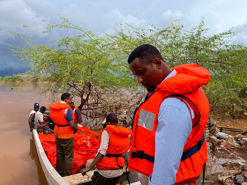 World Vision staff in Somalia in a boat delivering aid